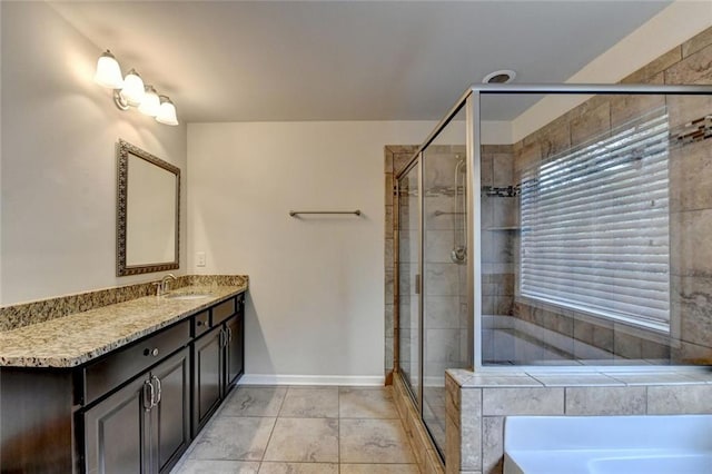 4191 Secret Shoals Way, Buford, GA 30518 - full bath with a garden tub, a stall shower, vanity, tile patterned floors, and baseboards