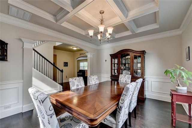 4191 Secret Shoals Way, Buford, GA 30518 - dining room featuring arched walkways, dark wood-type flooring, a chandelier, coffered ceiling, and crown molding