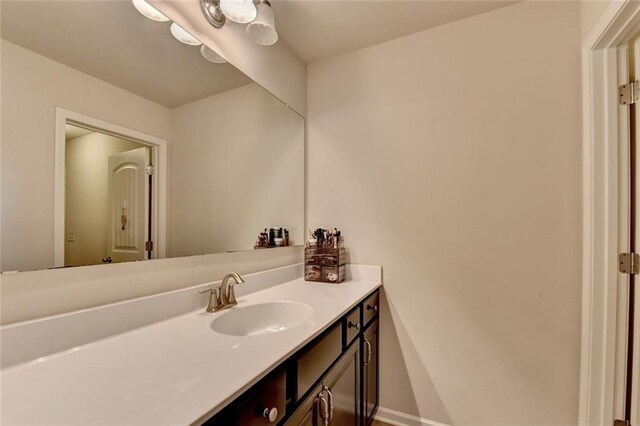 4191 Secret Shoals Way, Buford, GA 30518 - bathroom featuring vanity and baseboards