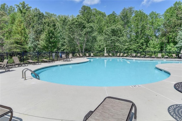4191 Secret Shoals Way, Buford, GA 30518 - community pool featuring a patio and view of wooded area