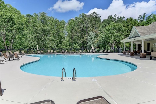 4191 Secret Shoals Way, Buford, GA 30518 - community pool with a patio area and view of wooded area