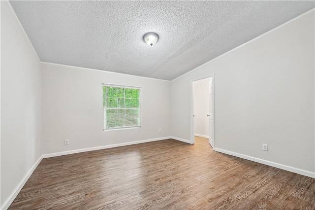 6670 George Ct, Cumming, GA 30041 - empty room featuring a textured ceiling, wood finished floors, and baseboards