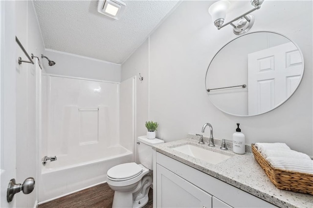 6670 George Ct, Cumming, GA 30041 - full bathroom featuring a textured ceiling, wood finished floors, vanity, toilet, and shower / washtub combination
