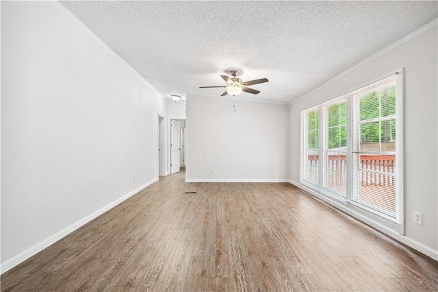 6670 George Ct, Cumming, GA 30041 - unfurnished room with wood finished floors, a textured ceiling, a ceiling fan, baseboards, and ornamental molding