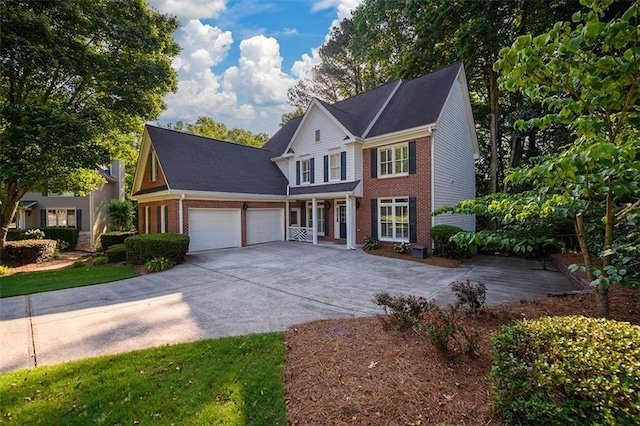 1304 Carrington Way, Lawrenceville, GA 30044 - view of front of home featuring brick siding, a garage, driveway, and covered porch