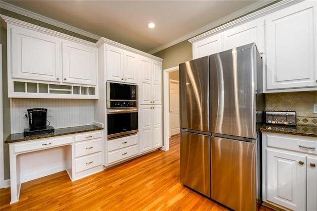 1304 Carrington Way, Lawrenceville, GA 30044 - kitchen with appliances with stainless steel finishes, crown molding, tasteful backsplash, light wood finished floors, and white cabinetry