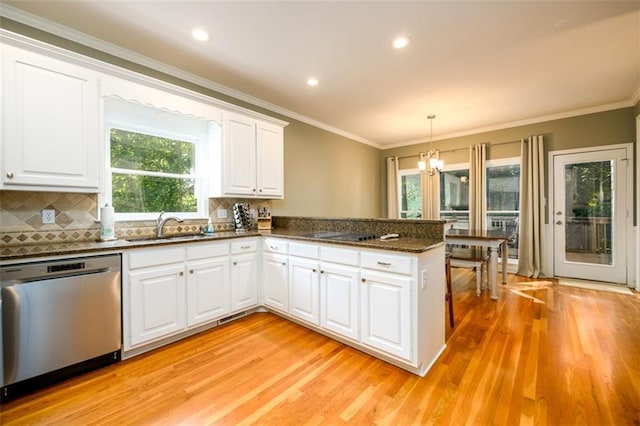 1304 Carrington Way, Lawrenceville, GA 30044 - kitchen featuring stainless steel dishwasher, light wood-type flooring, healthy amount of natural light, a peninsula, and ornamental molding