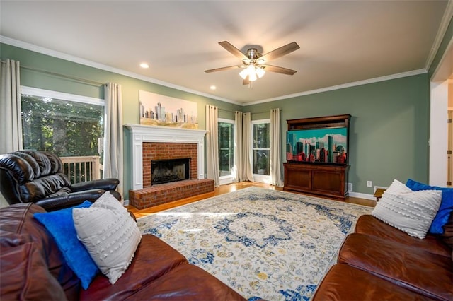 1304 Carrington Way, Lawrenceville, GA 30044 - living room with plenty of natural light, a ceiling fan, crown molding, baseboards, and a brick fireplace