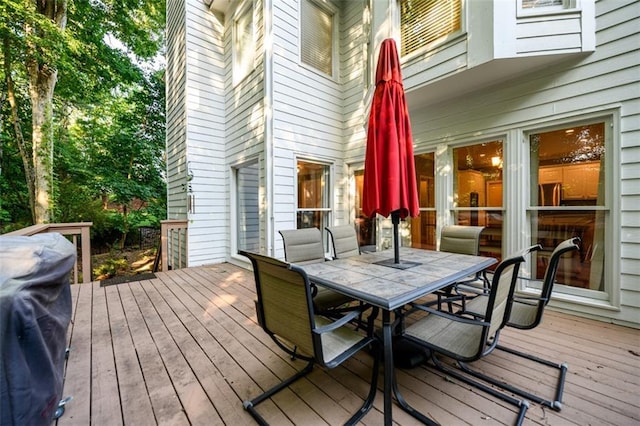 1304 Carrington Way, Lawrenceville, GA 30044 - wooden terrace with outdoor dining space