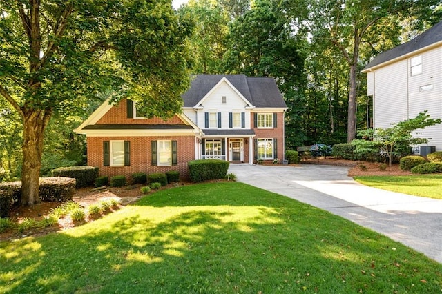 1304 Carrington Way, Lawrenceville, GA 30044 - traditional-style home featuring brick siding, concrete driveway, central air condition unit, and a front lawn