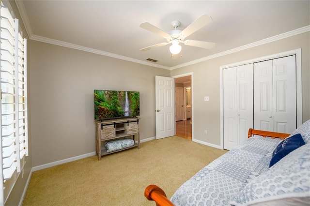 1304 Carrington Way, Lawrenceville, GA 30044 - bedroom featuring crown molding, light colored carpet, baseboards, ceiling fan, and a closet