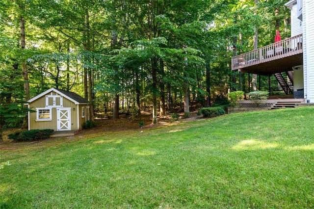 1304 Carrington Way, Lawrenceville, GA 30044 - view of grassy yard featuring stairs, a wooden deck, and view of wooded area