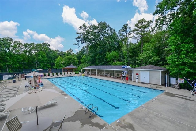 1304 Carrington Way, Lawrenceville, GA 30044 - community pool featuring a patio and view of wooded area