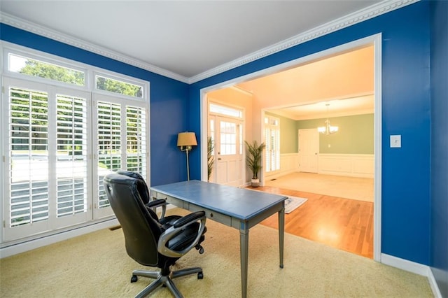 1304 Carrington Way, Lawrenceville, GA 30044 - home office with crown molding, a chandelier, wainscoting, wood finished floors, and a decorative wall