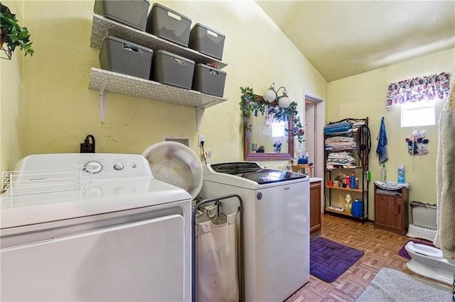 clothes washing area featuring washing machine and clothes dryer