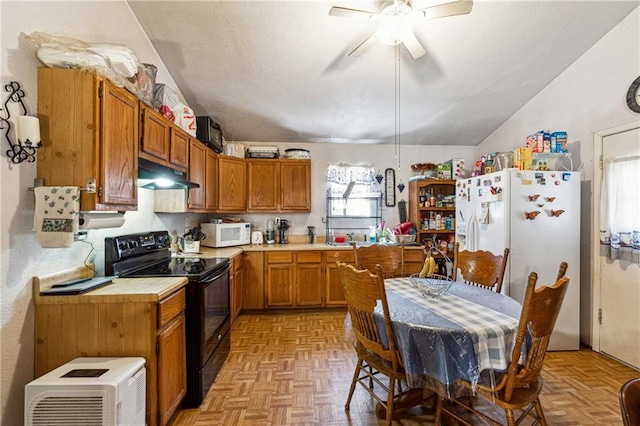 kitchen with light countertops, ceiling fan, under cabinet range hood, and white appliances