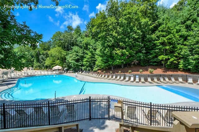 1115 Wild Turkey Blf, Jasper, GA 30143 - community pool with view of scattered trees and a patio