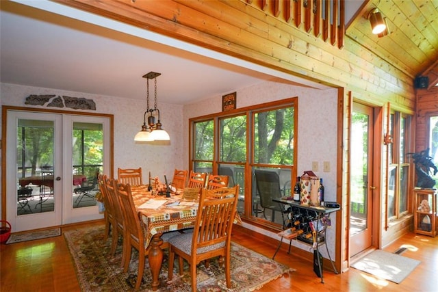 1115 Wild Turkey Blf, Jasper, GA 30143 - dining space with french doors, healthy amount of natural light, wood finished floors, and wallpapered walls