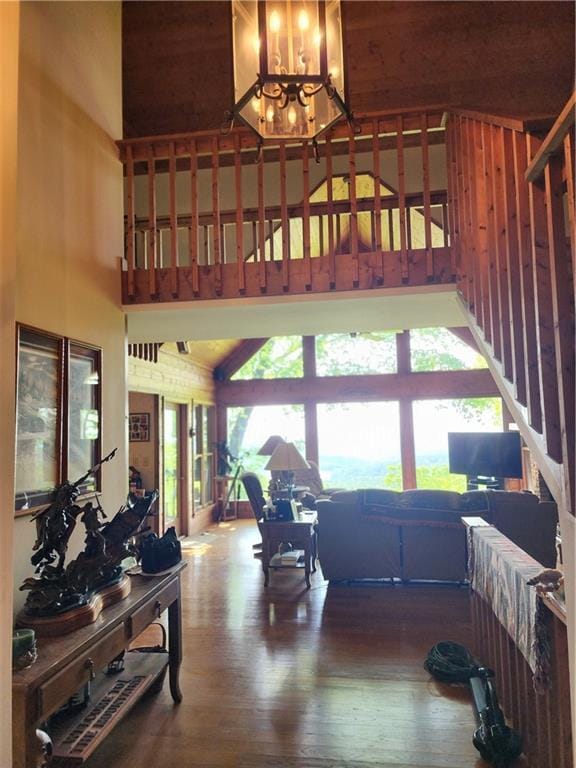 1115 Wild Turkey Blf, Jasper, GA 30143 - living room with a high ceiling, a chandelier, and hardwood / wood-style flooring