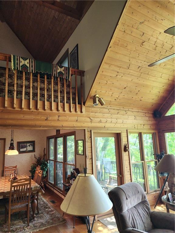 1115 Wild Turkey Blf, Jasper, GA 30143 - living area featuring wood ceiling, wood-type flooring, high vaulted ceiling, and healthy amount of natural light