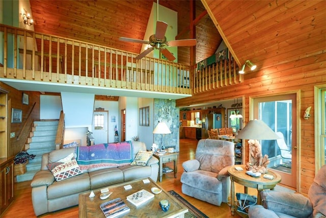 1115 Wild Turkey Blf, Jasper, GA 30143 - living room with high vaulted ceiling, wood finished floors, ceiling fan, stairs, and wooden ceiling