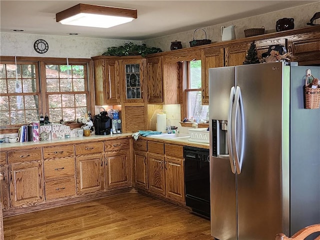 1115 Wild Turkey Blf, Jasper, GA 30143 - kitchen featuring stainless steel refrigerator with ice dispenser, black dishwasher, light countertops, and brown cabinets