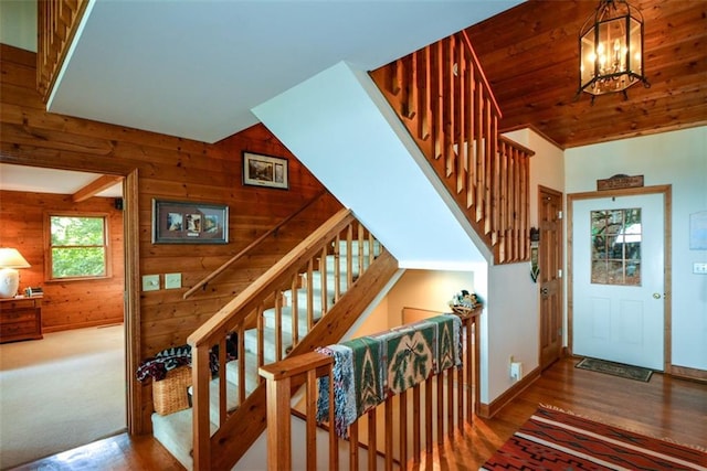 1115 Wild Turkey Blf, Jasper, GA 30143 - stairs with wooden walls, wood finished floors, and a chandelier