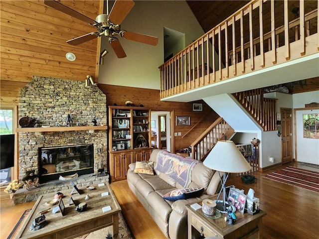 1115 Wild Turkey Blf, Jasper, GA 30143 - living area with high vaulted ceiling, wood finished floors, ceiling fan, stairway, and a fireplace