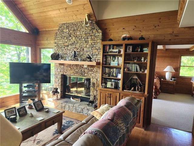 1115 Wild Turkey Blf, Jasper, GA 30143 - living area featuring wooden walls, wood finished floors, lofted ceiling, a stone fireplace, and wood ceiling