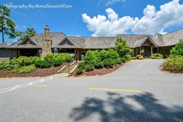 1115 Wild Turkey Blf, Jasper, GA 30143 - view of front of home with uncovered parking, a chimney, and stairs