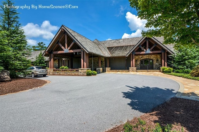 1115 Wild Turkey Blf, Jasper, GA 30143 - view of front facade featuring stone siding and curved driveway