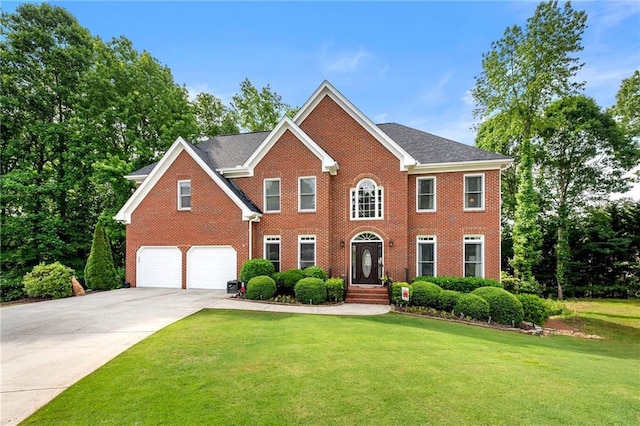 370 Fairleaf Ct, Alpharetta, GA 30022 - colonial home with brick siding, an attached garage, concrete driveway, and a front yard