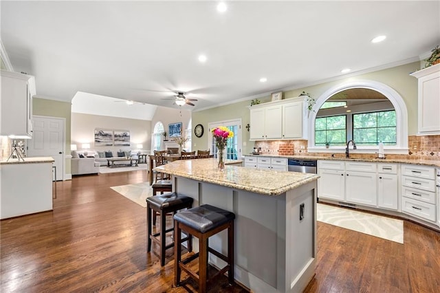 370 Fairleaf Ct, Alpharetta, GA 30022 - kitchen with a ceiling fan, a sink, ornamental molding, white cabinets, and a center island