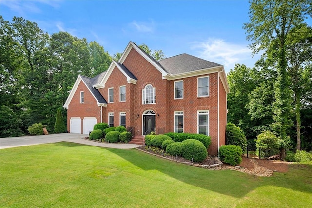 370 Fairleaf Ct, Alpharetta, GA 30022 - colonial-style house featuring driveway, an attached garage, and brick siding