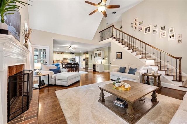 370 Fairleaf Ct, Alpharetta, GA 30022 - living area featuring ceiling fan, high vaulted ceiling, a fireplace, stairway, and wood finished floors