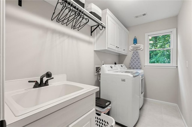 370 Fairleaf Ct, Alpharetta, GA 30022 - clothes washing area featuring cabinet space, washing machine and clothes dryer, baseboards, and light tile patterned flooring