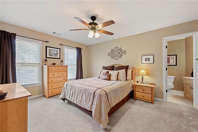 370 Fairleaf Ct, Alpharetta, GA 30022 - bedroom with light colored carpet, baseboards, connected bathroom, and ceiling fan