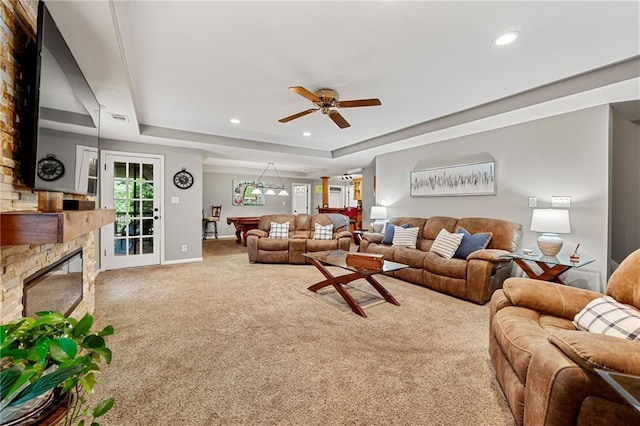 370 Fairleaf Ct, Alpharetta, GA 30022 - carpeted living area with a glass covered fireplace, a raised ceiling, recessed lighting, baseboards, and a ceiling fan