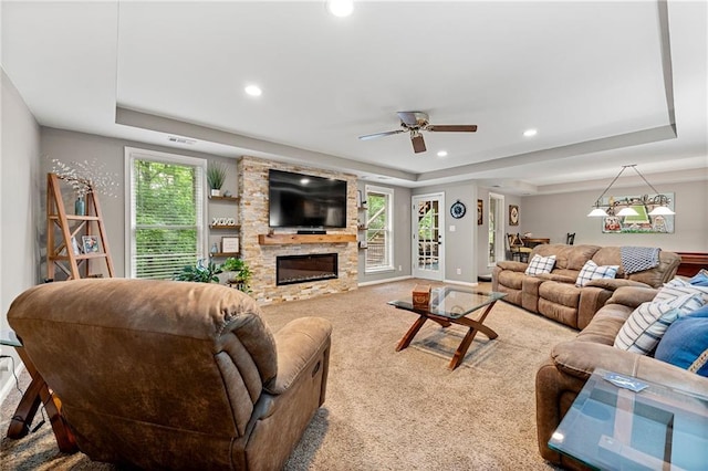 370 Fairleaf Ct, Alpharetta, GA 30022 - carpeted living area featuring a raised ceiling, a fireplace, recessed lighting, a ceiling fan, and baseboards