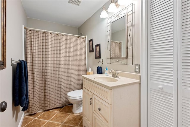 370 Fairleaf Ct, Alpharetta, GA 30022 - bathroom featuring toilet, vanity, a closet, tile patterned flooring, and curtained shower