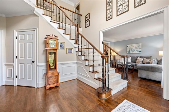 370 Fairleaf Ct, Alpharetta, GA 30022 - staircase with wood finished floors, ornamental molding, a wainscoted wall, and a decorative wall