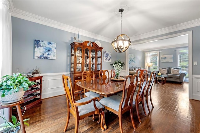 370 Fairleaf Ct, Alpharetta, GA 30022 - dining space featuring ornamental molding, a chandelier, wood finished floors, a wainscoted wall, and a decorative wall