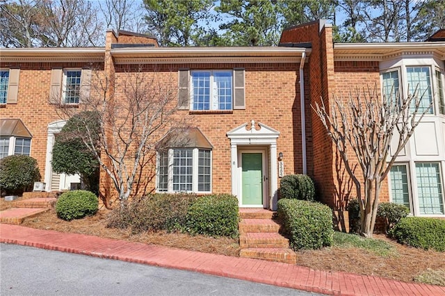 view of front of home featuring brick siding