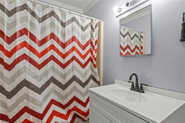 bathroom with walk in shower, vanity, and ornamental molding