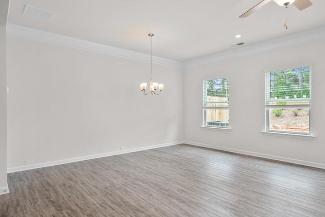 unfurnished room with visible vents, crown molding, and baseboards