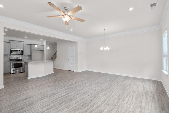 unfurnished living room featuring light wood-type flooring, visible vents, and baseboards