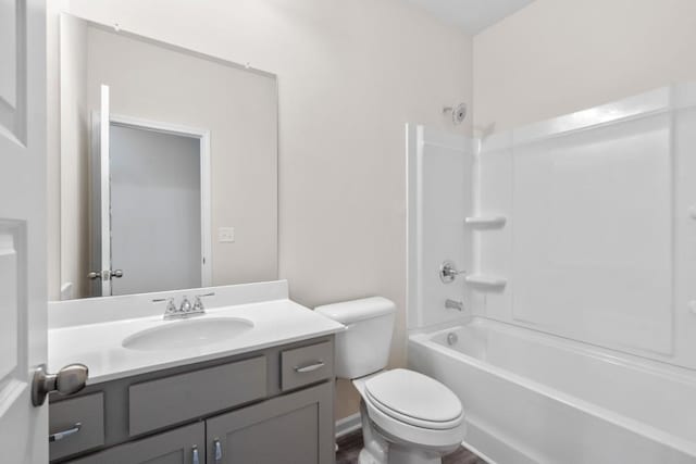 full bathroom with vanity, toilet, and shower / bathtub combination