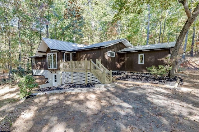 view of front of property with a wooden deck