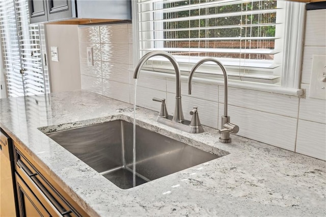 1755 Pinetree Pass Ln SW, Lilburn, GA 30047 - interior space with a sink, tasteful backsplash, and light stone countertops