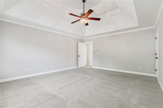 1755 Pinetree Pass Ln SW, Lilburn, GA 30047 - carpeted empty room featuring ornamental molding, a tray ceiling, ceiling fan, and baseboards